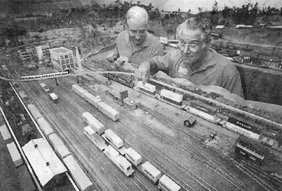 Len Hughes, left, and Tony Gray are preparing to pack up their Sydney mono-rail system and head for a new station in life.