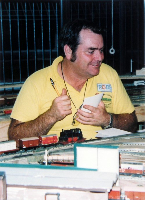 Tubby (wearing a Pilbara Railway Historical Society shirt) obviously enjoying himself during an operating session on John Harken’s model railway. Photo courtesy of Don Finlayson.